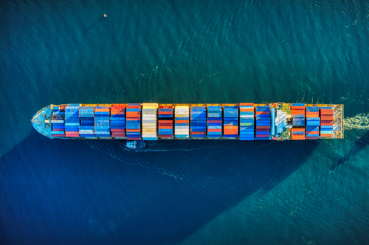 Cargo ship with colorful cargo containers on the ocean